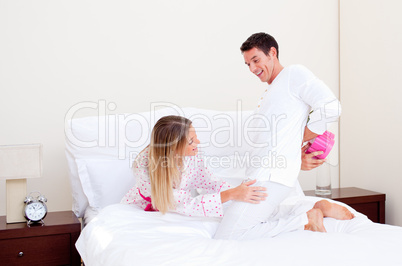 Loving husband giving a present to his wife