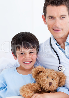 Portrait of a cute little boy and his doctor