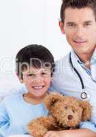 Portrait of a cute little boy and his doctor