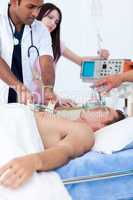 Serious medical team resuscitating a patient