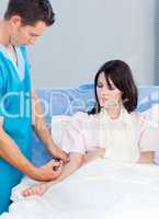 Concentrated doctor giving an injection to a woman