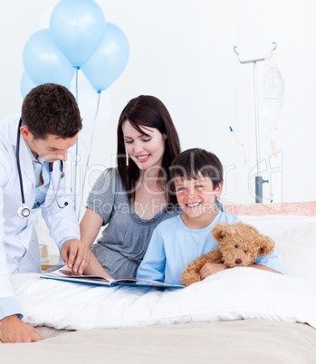 Serious doctor talking with a little boy and his mother