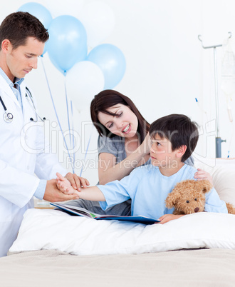 Charming doctor examining patient's arm