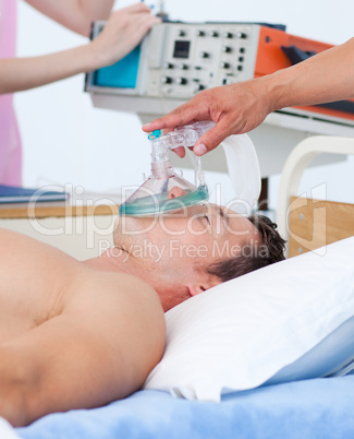 Sick patient receiving receiving oxygen