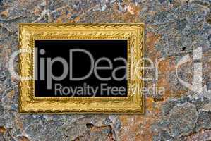 Stone background with vintage gold frame