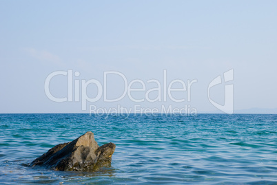 Coast of sea with stones in water