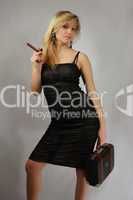 beautiful blonde with cigar and valise