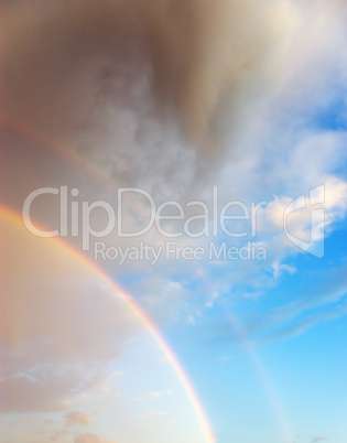 Beautiful cloudscape with rainbow