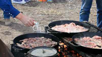 Lamb meat cooking salt over fire
