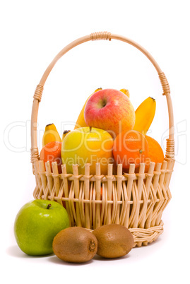 Basket with colorful fruits on a white background