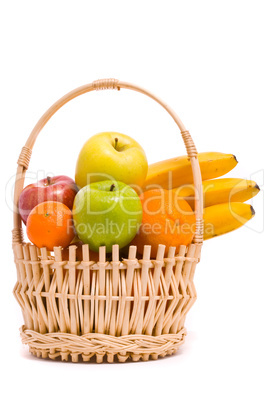 Basket with colorful fruits on a white background