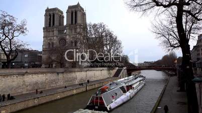 Notre Dame de Paris and pleasure boat on channel