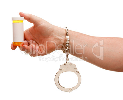 Handcuffed Man Holding Blank Medicine Bottle Isolated on White