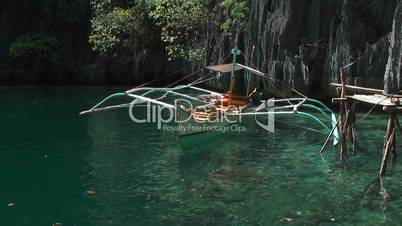 Traditional Philippines boat in lagoon (view from boat)