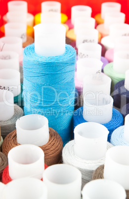 spool with blue thread