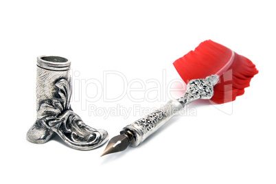 old pen with red feather and holder