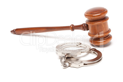 Gavel and Handcuffs on White