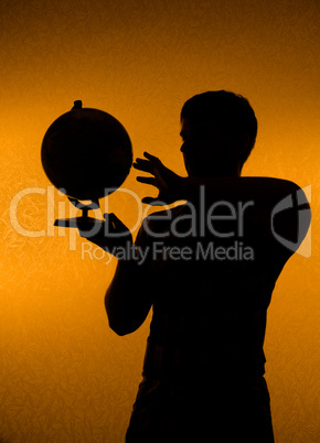 Discover the world - silhouette of man holding globe