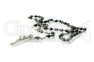 Black rosary isolated over white
