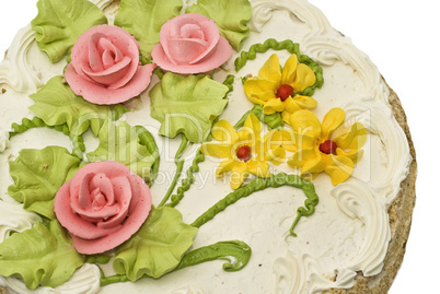 Close-up of tasty cake with cream, pink roses