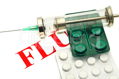 Disease alert - pills and syringe over white