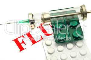 Disease alert - pills and syringe over white