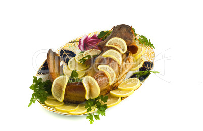 Food - bloated fresh-water catfish (sheatfish) with lemon