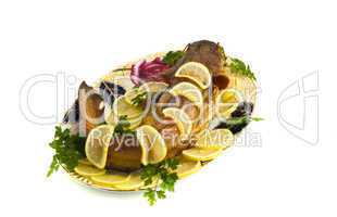 Food - bloated fresh-water catfish (sheatfish) with lemon