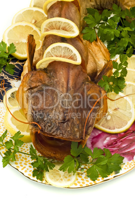 Shore dinner - smoke-dried sheatfish with lemon