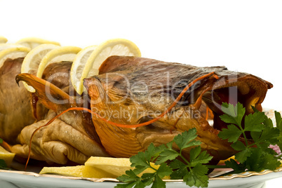 Shore dinner - tasty smoke-dried sheatfish with lemon and parsle
