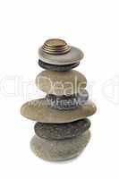 Stability, wealth and welfare - stone stack with coins