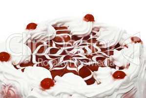 Sweet dessert - iced cake with cherries