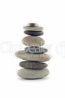 Welfare and Stability  - Balanced stone stack with coins