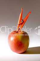 Apple and clothespin