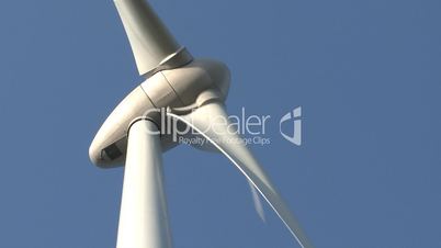 Wind power turbine on blue sky