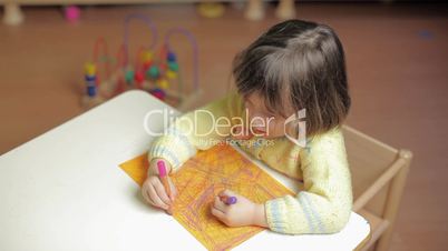 2-3 years old girl drawing in kindergarten