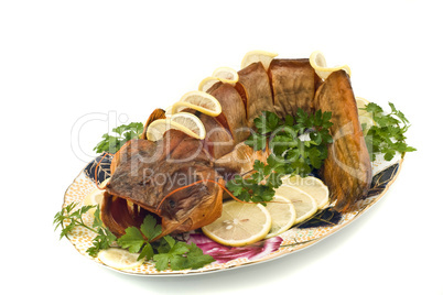 Bloated fresh-water catfish (sheatfish) with lemon