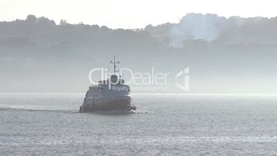 Ferry boat across the river in fog