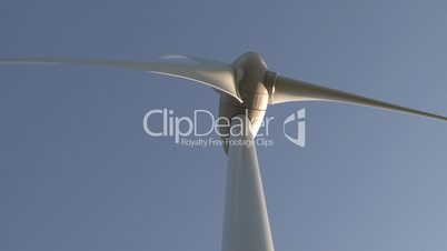 Wind power turbine on blue sky