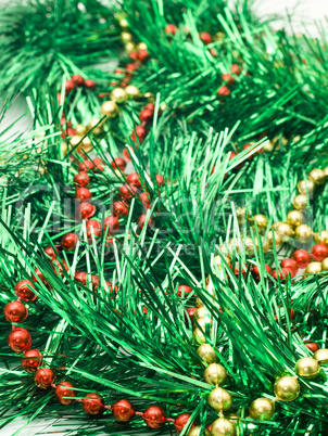 Christmas comes - green tinsel and beads