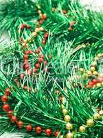 Christmas comes - green tinsel and beads