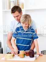 Loving father helping his son prepare the breakfast