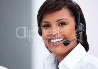 Portrait of an ethnic customer service agent at work