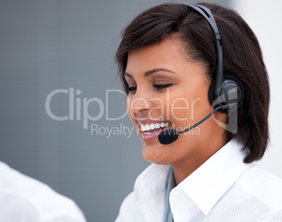 Portrait of a laughing customer service agent at work