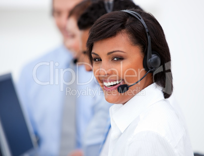 Close-up of an ethnic customer service agent and her team