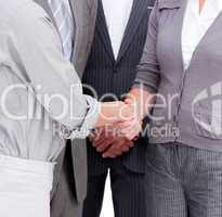 Close-up of a positive businessteam closing a deal