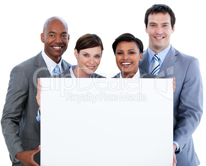 Happy business team holding a white card