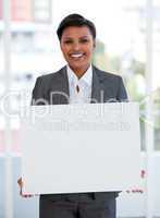 Portrait of a female manager holding a white board