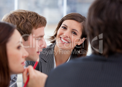 Portrait of an assertive businesswoman and her team