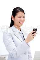 Portrait of a smiling businesswoman looking at his phone